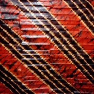 Bazin Riche teinté fond rouge motif bariolé